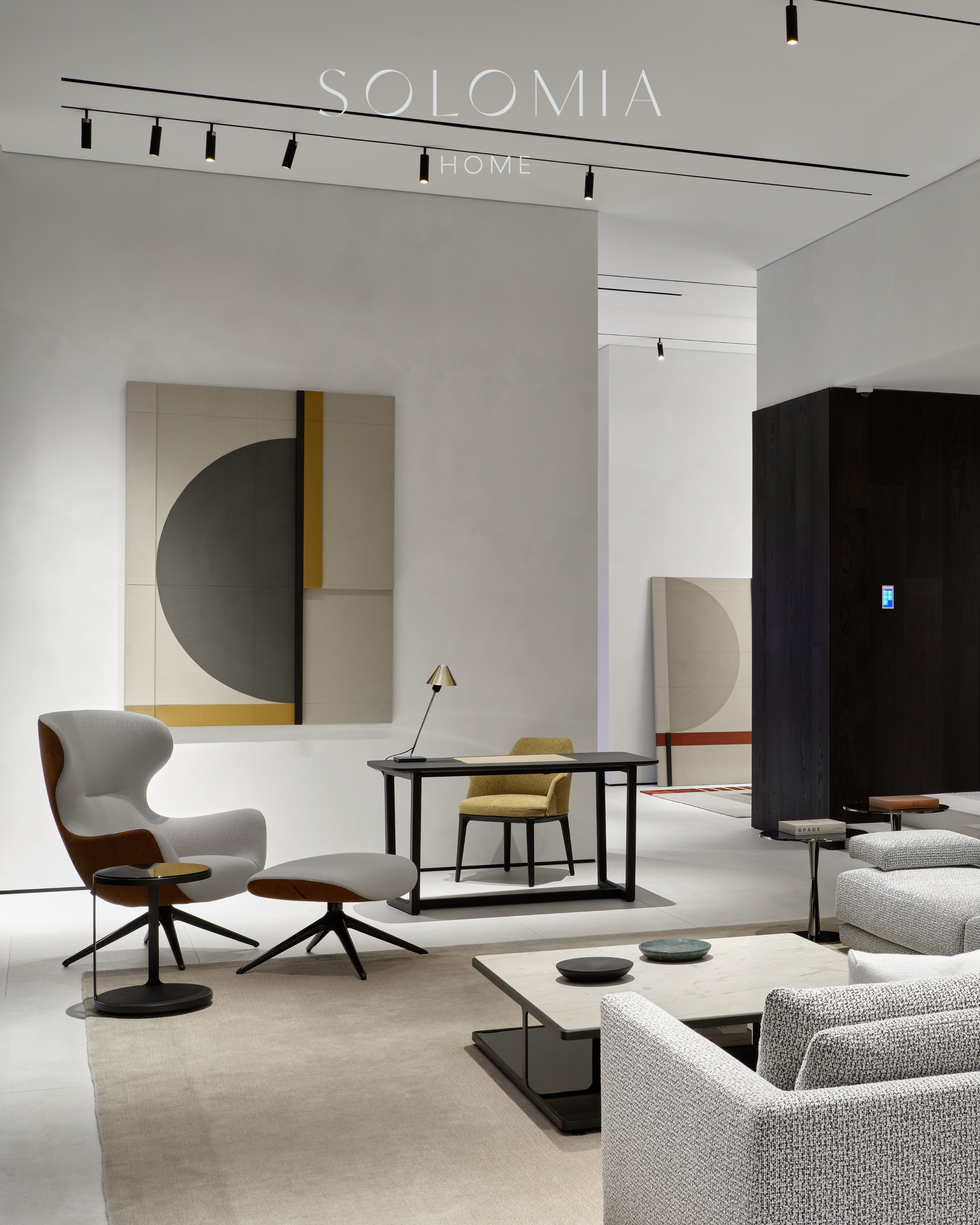 Lounge with grey armchair and shelving, Poliform Project — showroom interior design Astana