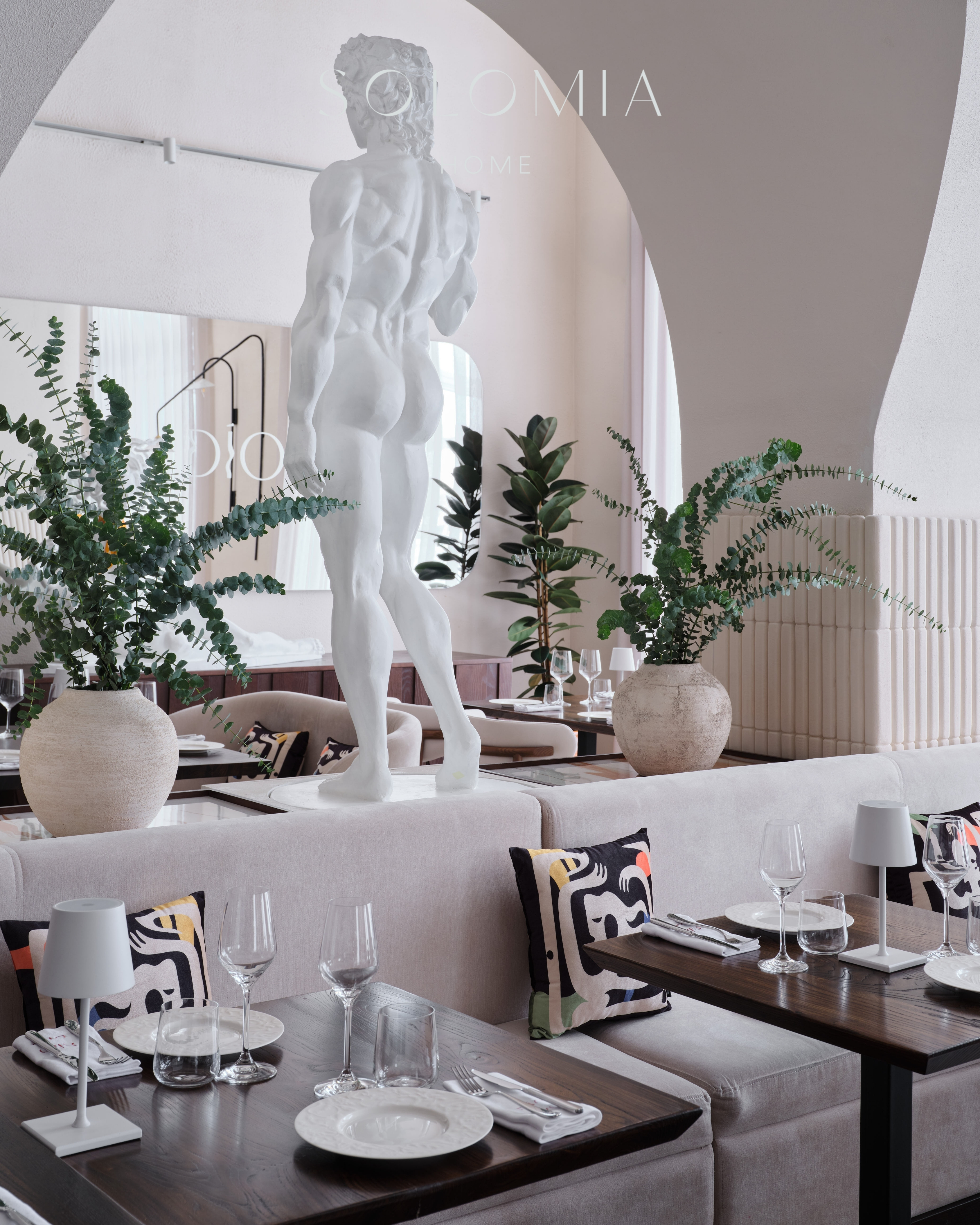 Dining area with statue and plants, Restaurant Dio Grand Cafe — restaurant interior design Astana