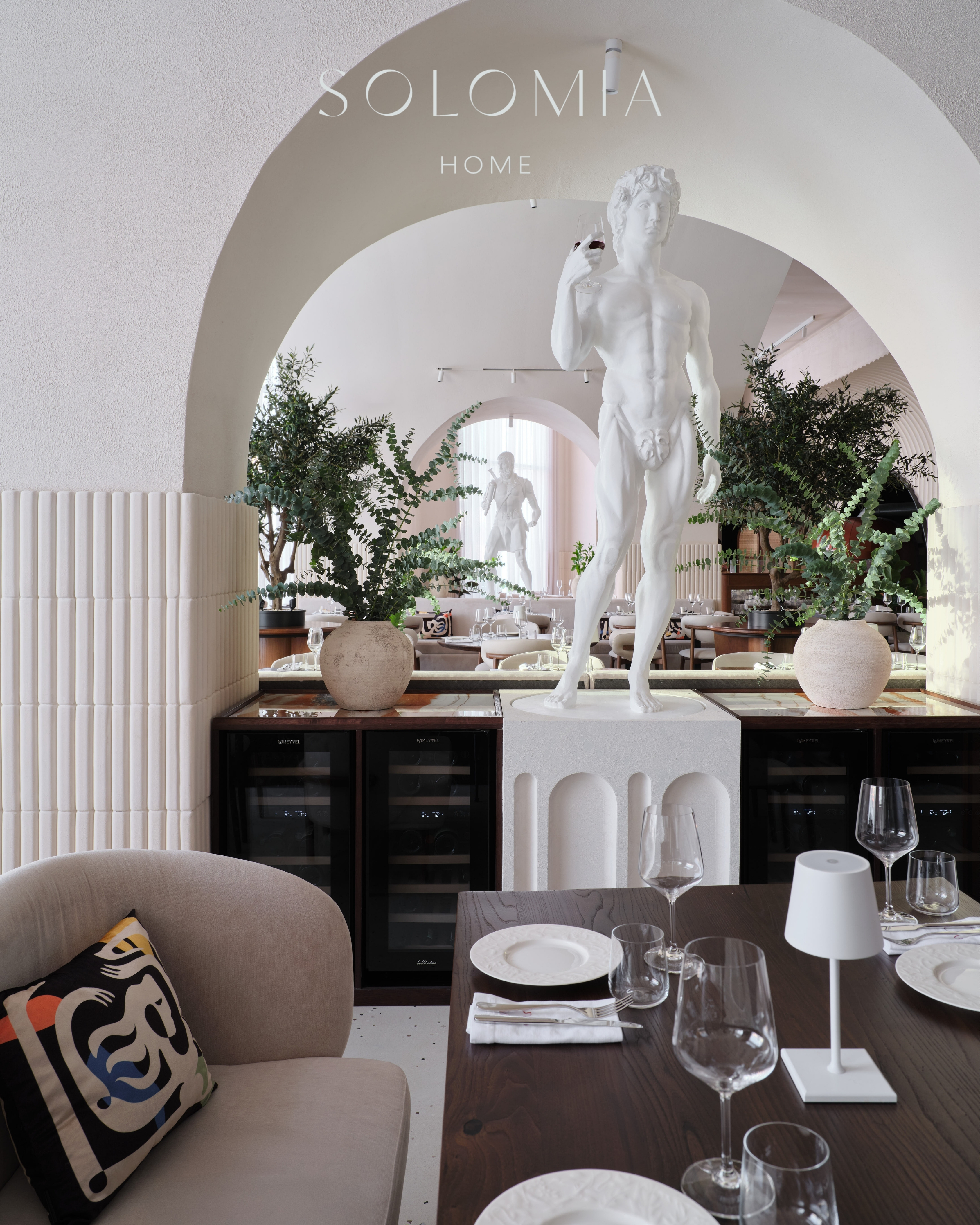 Table by the statue with cushions, Restaurant Dio Grand Cafe — restaurant interior design Astana