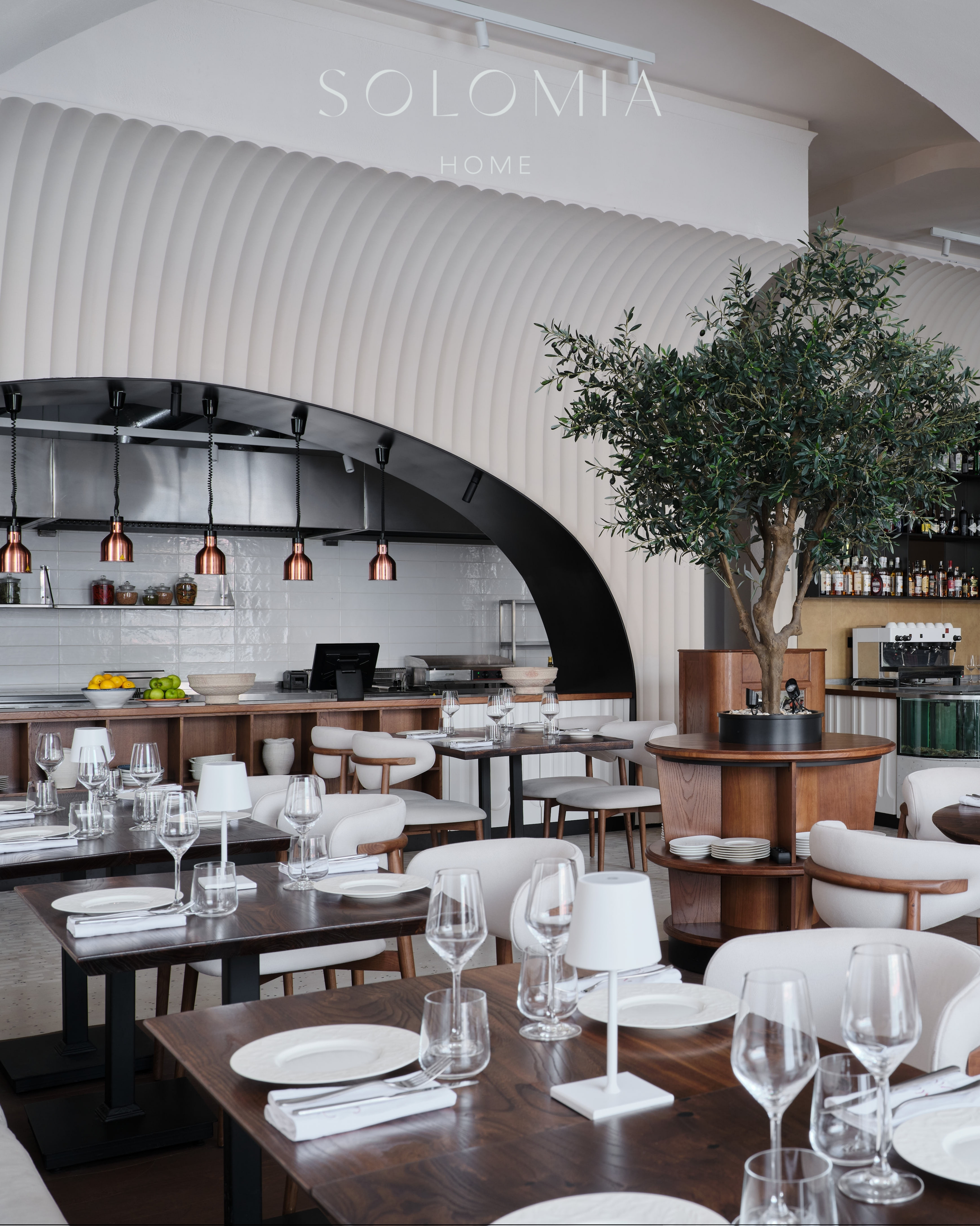 Dining tables by the open kitchen, Restaurant Dio Grand Cafe — restaurant interior design Astana