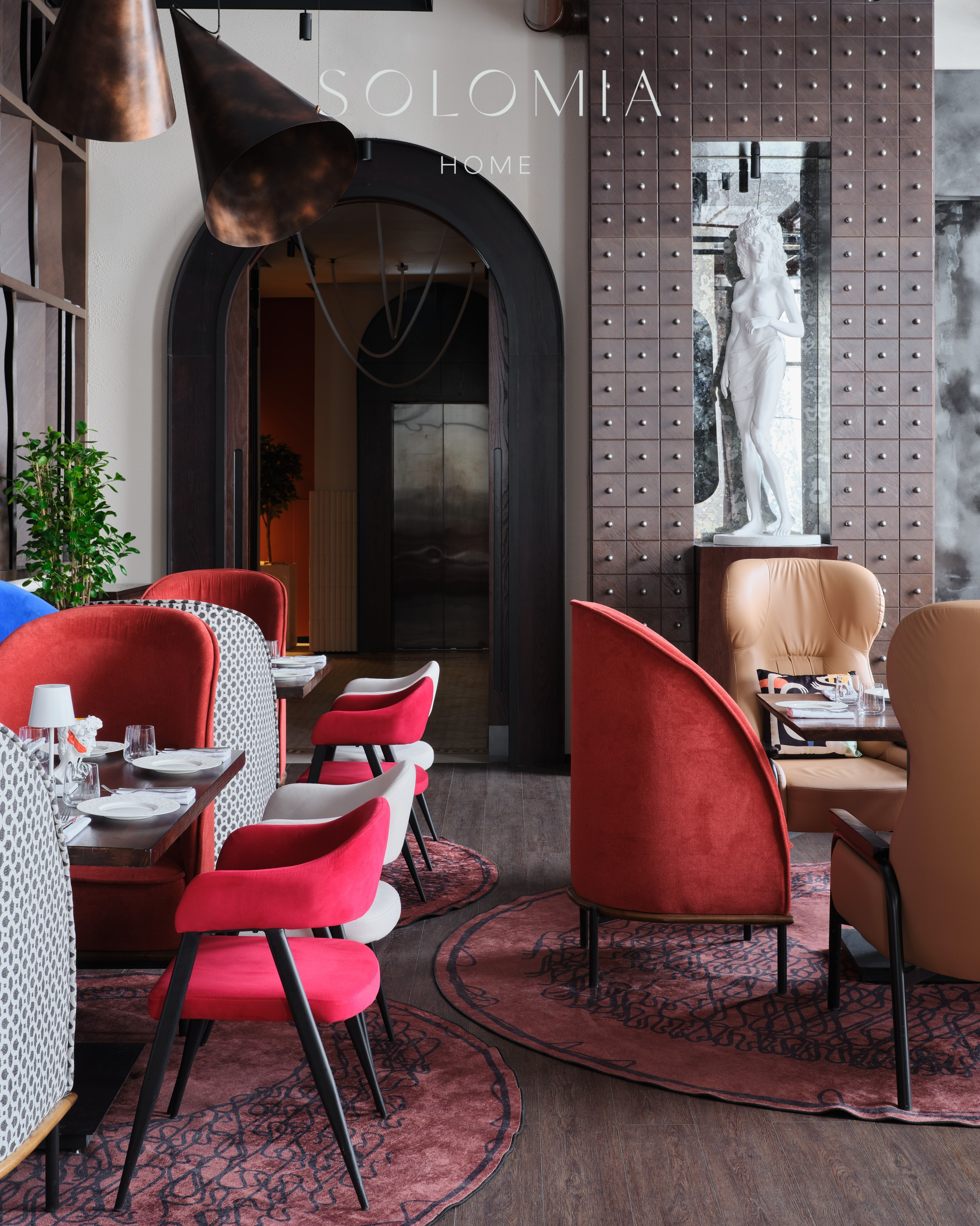 Dining area with red chairs and arched doorway, Restaurant Dio Grand Cafe — restaurant interior design Astana