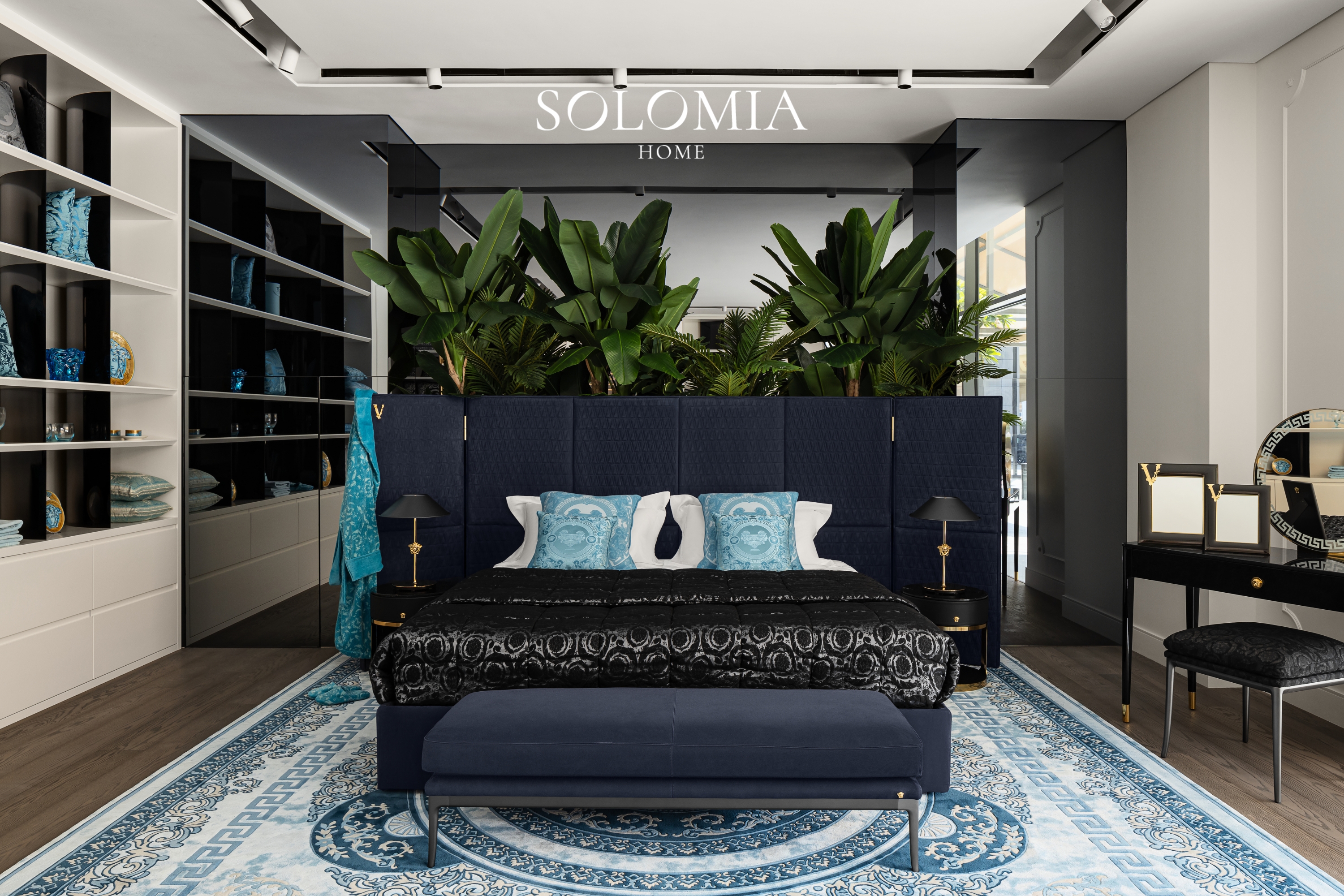 Versace bedroom display with navy bed, Versace Home showroom Dubai Mall — commercial interior design by Solomia Design