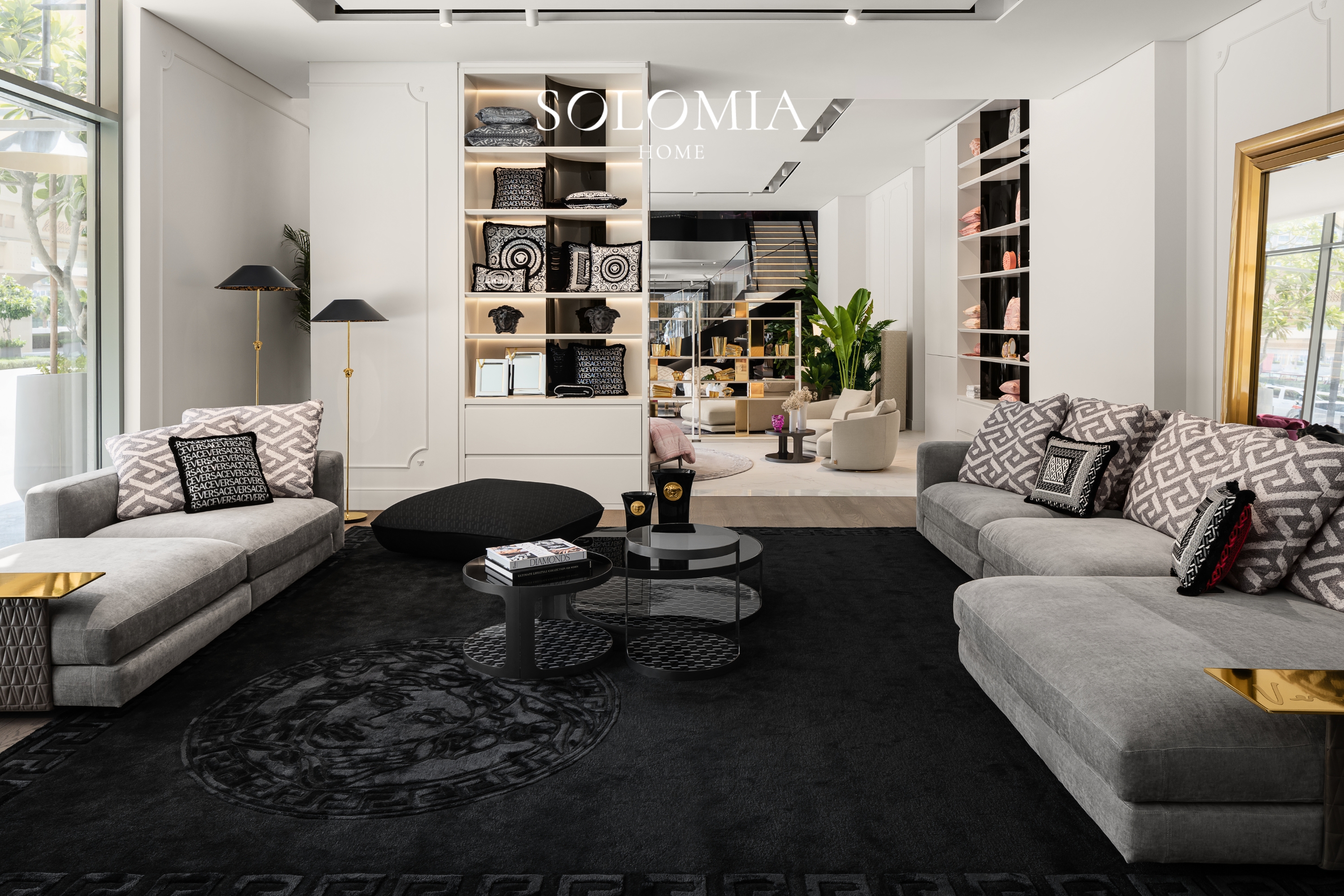 Showroom lounge with Greek-key cushions, Versace Home showroom Dubai Mall — commercial interior design by Solomia Design