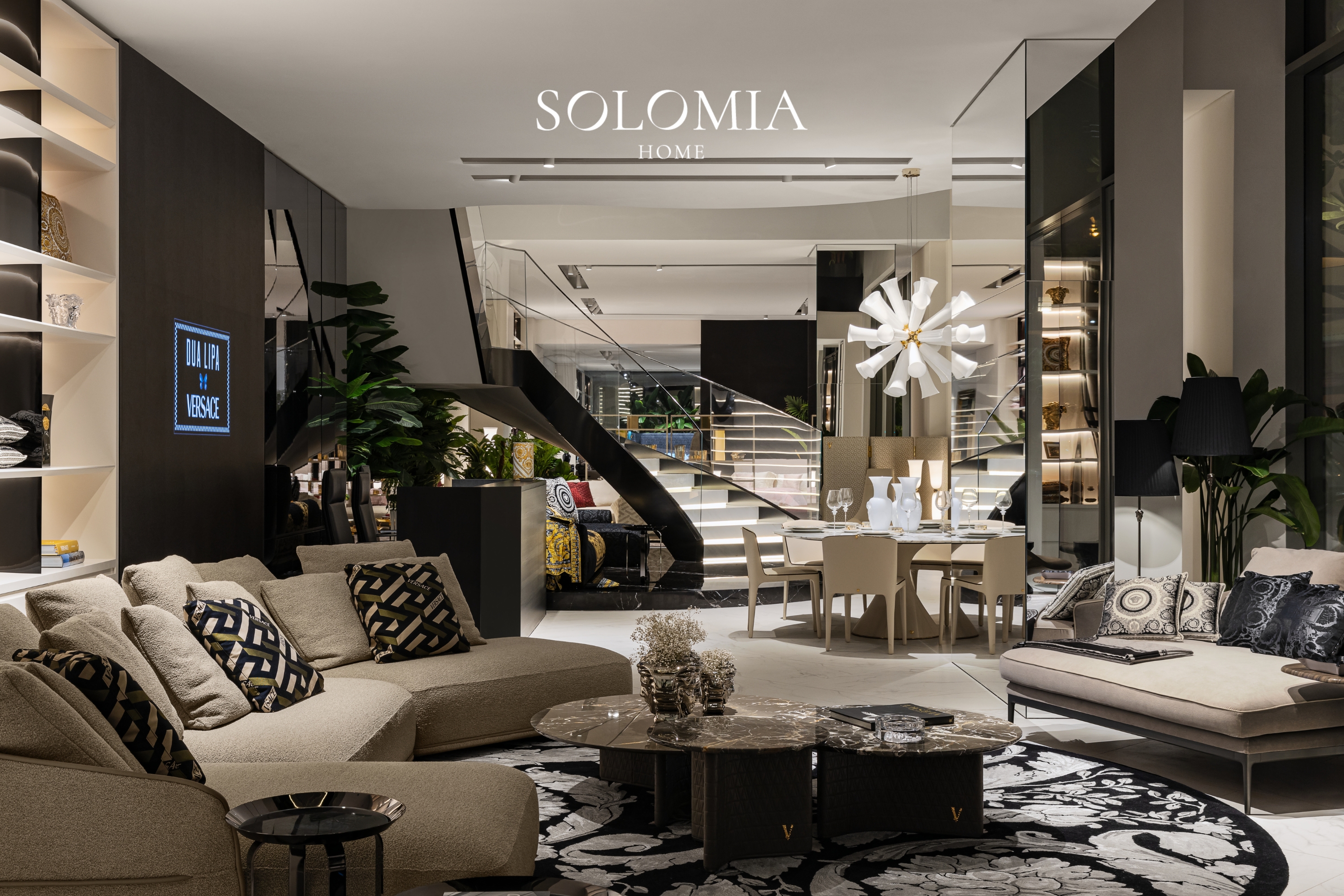 Showroom lounge with oval light and staircase, Versace Home showroom Dubai Mall — commercial interior design by Solomia Design