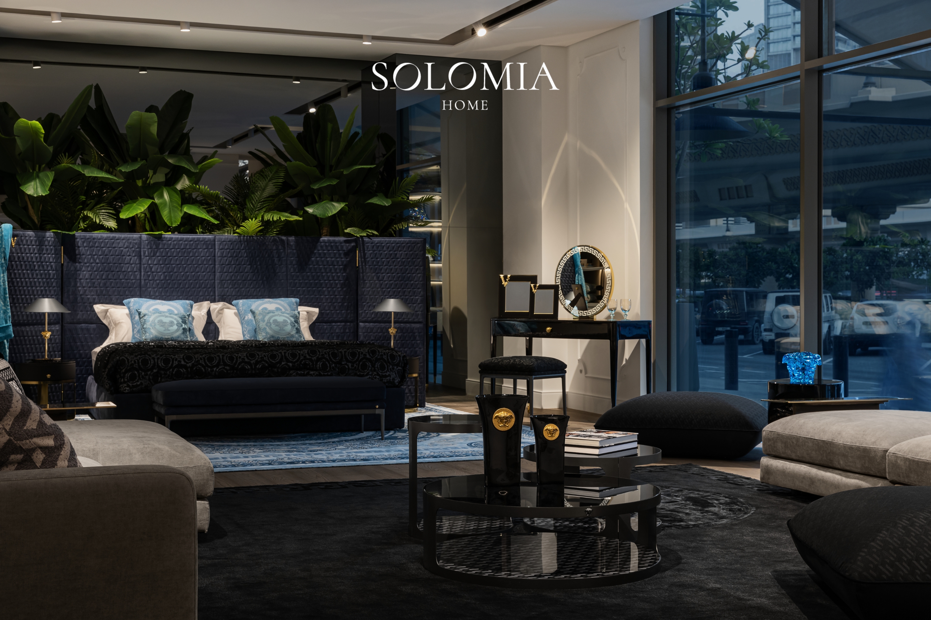 Showroom lounge at night with navy sofa, Versace Home showroom Dubai Mall — commercial interior design by Solomia Design