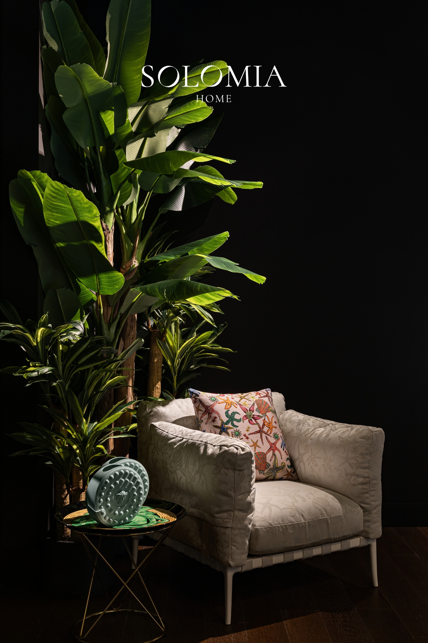 Armchair with tropical plants, Versace Home showroom Dubai Mall — commercial interior design by Solomia Design