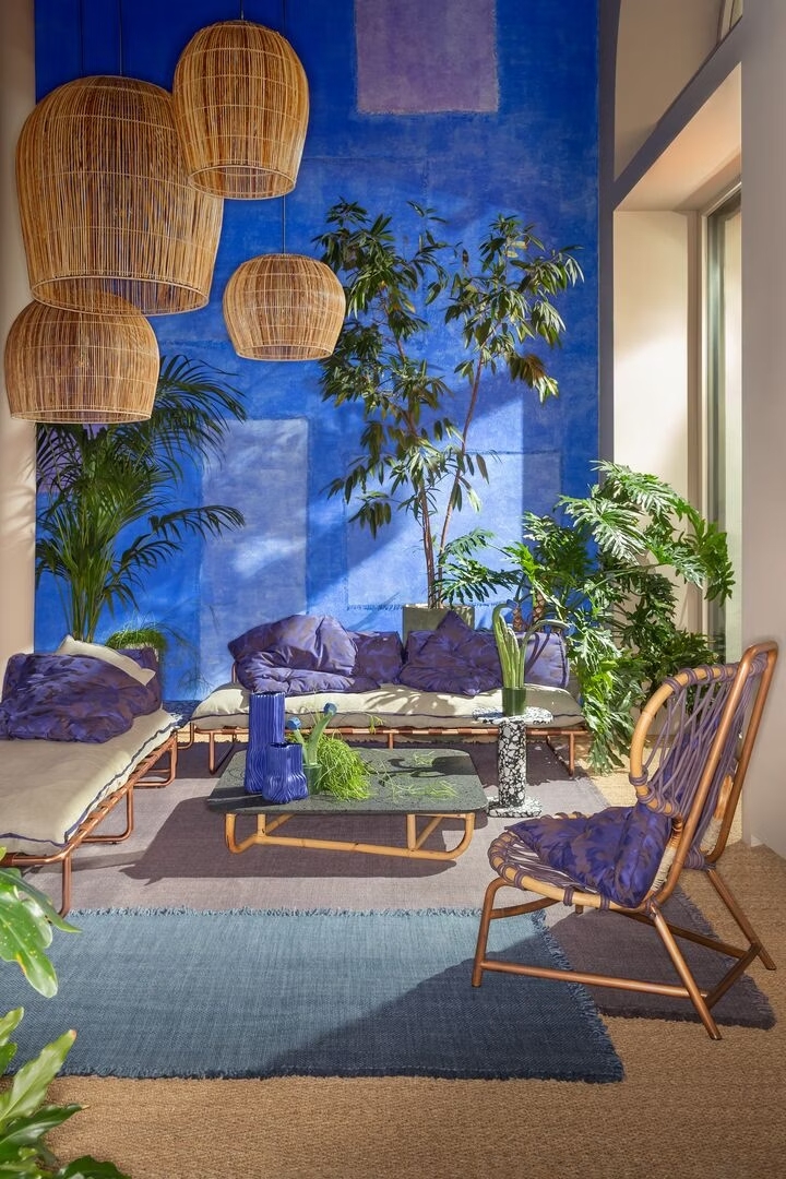 Blue living room with rattan pendant lamps — Solomia Design, interior design company in Dubai