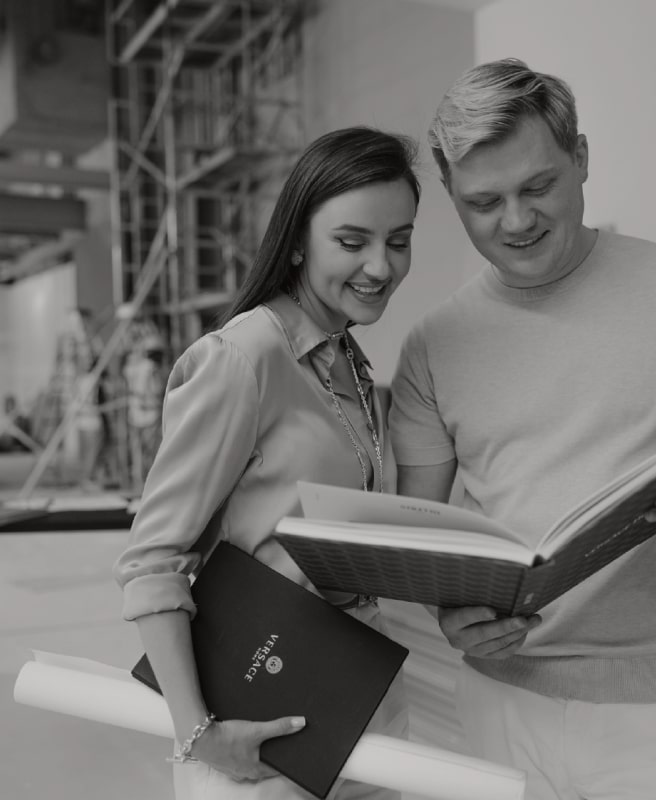 Solomia Design designers with a project book on site — interior design company in Dubai
